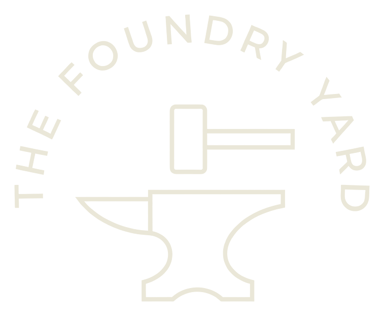 The Foundry Yard — anvil and hammer emblem
